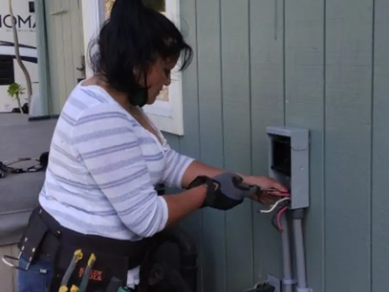Licensed electrician wiring an exterior subpanel in Soda Springs